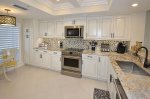 Kitchen With Stainless Steel Appliances & Tile Backsplash